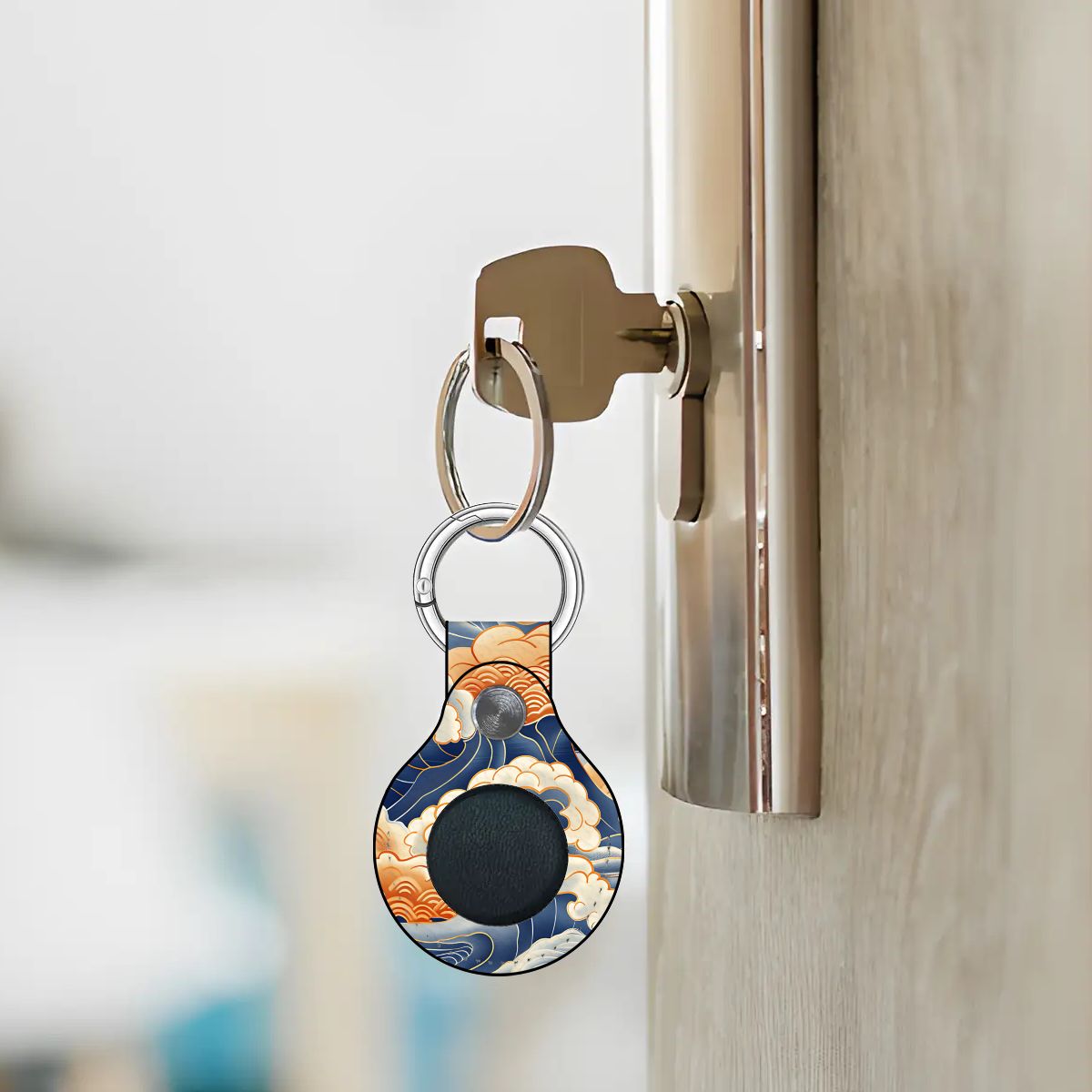 Airtag holder with a small device attached to a door handle