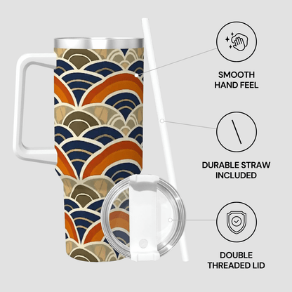 Travel mug with wave pattern, lid, and straw on a light gray background