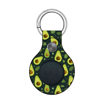 A keychain with a dark green avocado-patterned leather tag and a silver metal split ring, shown on a plain white background.