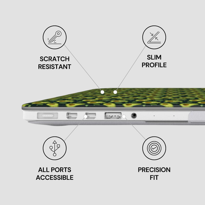 A close-up side view of a laptop with a green and black patterned protective skin or case on top. Four callout icons and text labels surround the product, reading 'SCRATCH RESISTANT,' 'SLIM PROFILE,' 'ALL PORTS ACCESSIBLE,' and 'PRECISION FIT,' on a light gray background.