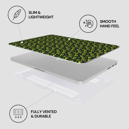 A laptop skin or cover with a green and yellow abstract pattern is shown floating above a silver laptop on a light gray background, with callout text reading 'SLIM & LIGHTWEIGHT,' 'SMOOTH HAND FEEL,' and 'FULLY VENTED & DURABLE.'.