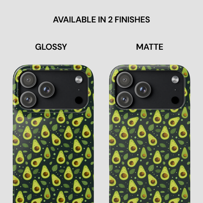 Two phone cases shown side by side on a light gray background, labeled Glossy and Matte. Both cases have a dark green avocado print with yellow-green halves, brown pits, and green leaves.