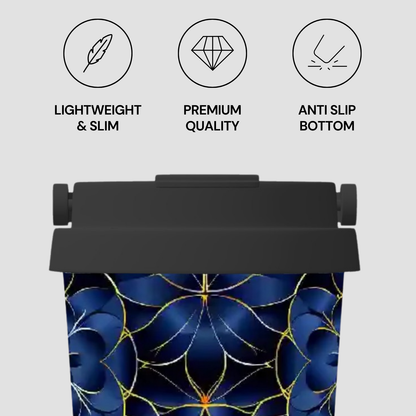 Tumbler with blue floral design and text indicating features on a gray background