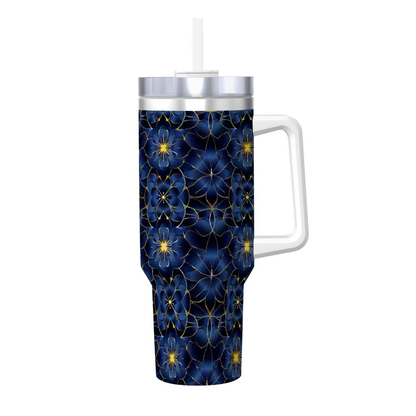 Tumbler with blue floral pattern and white handle on a white background