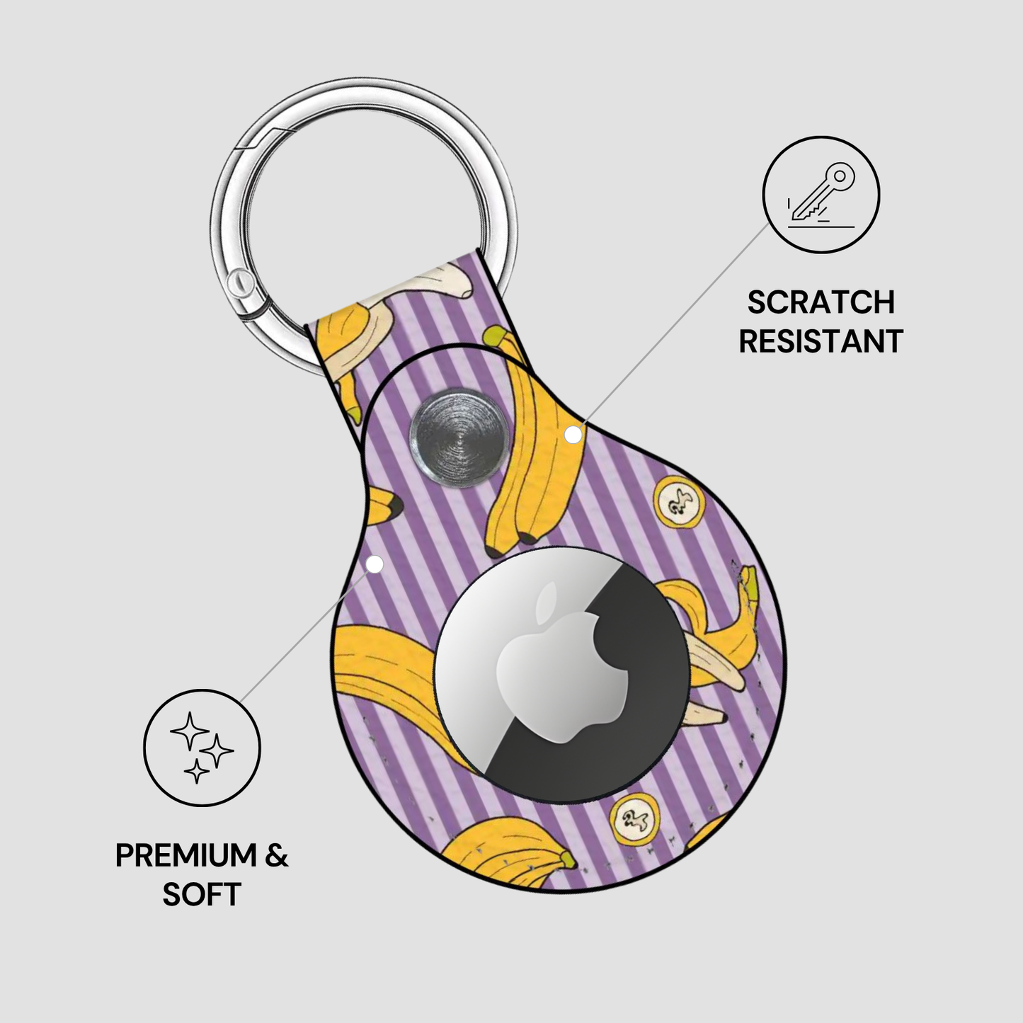 Purple and yellow striped keychain case with Apple logo on a light gray background
