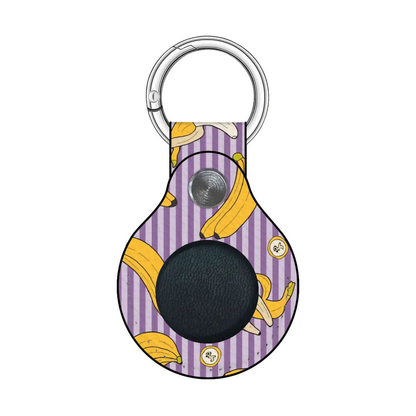 Keychain with banana pattern on a purple background