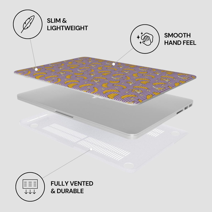 Laptop with a patterned cover on a light gray background, featuring text labels about the product's features.