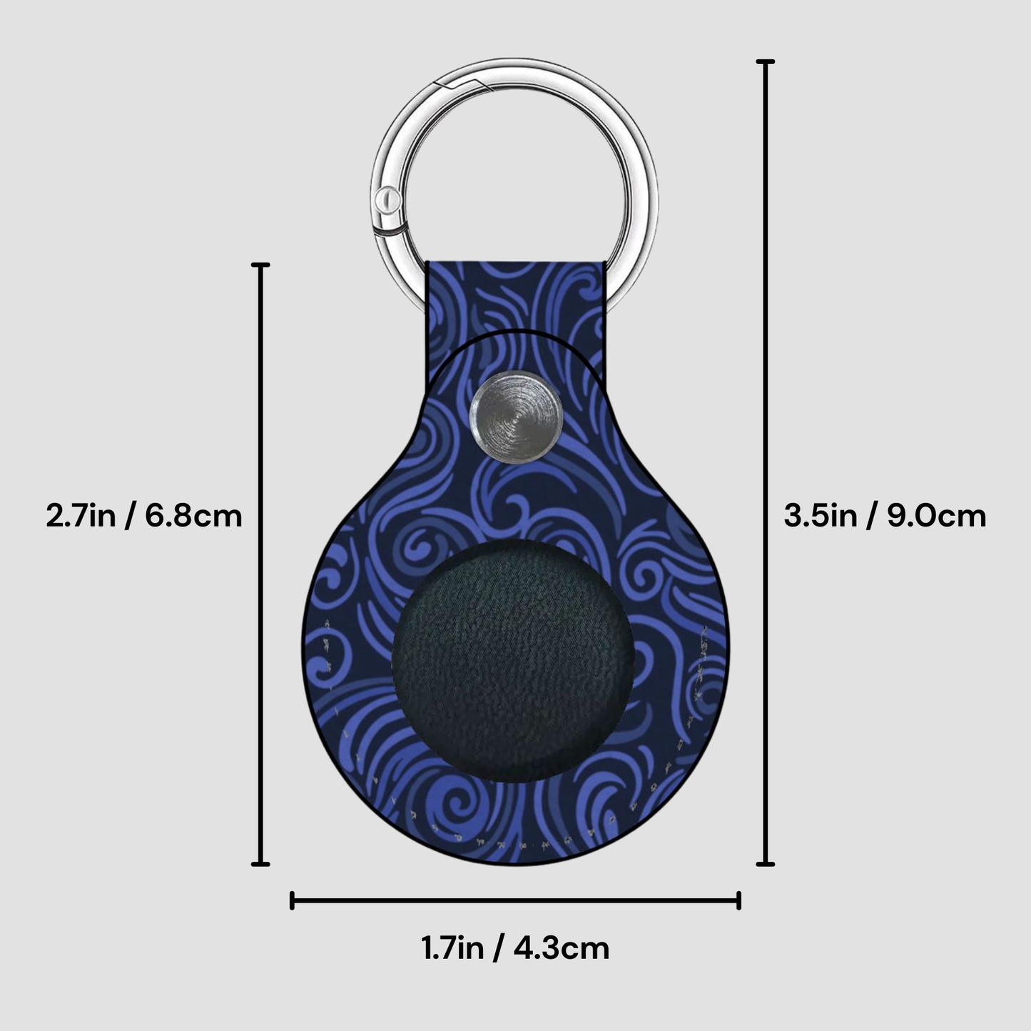 Blue patterned keychain with measurements on a gray background