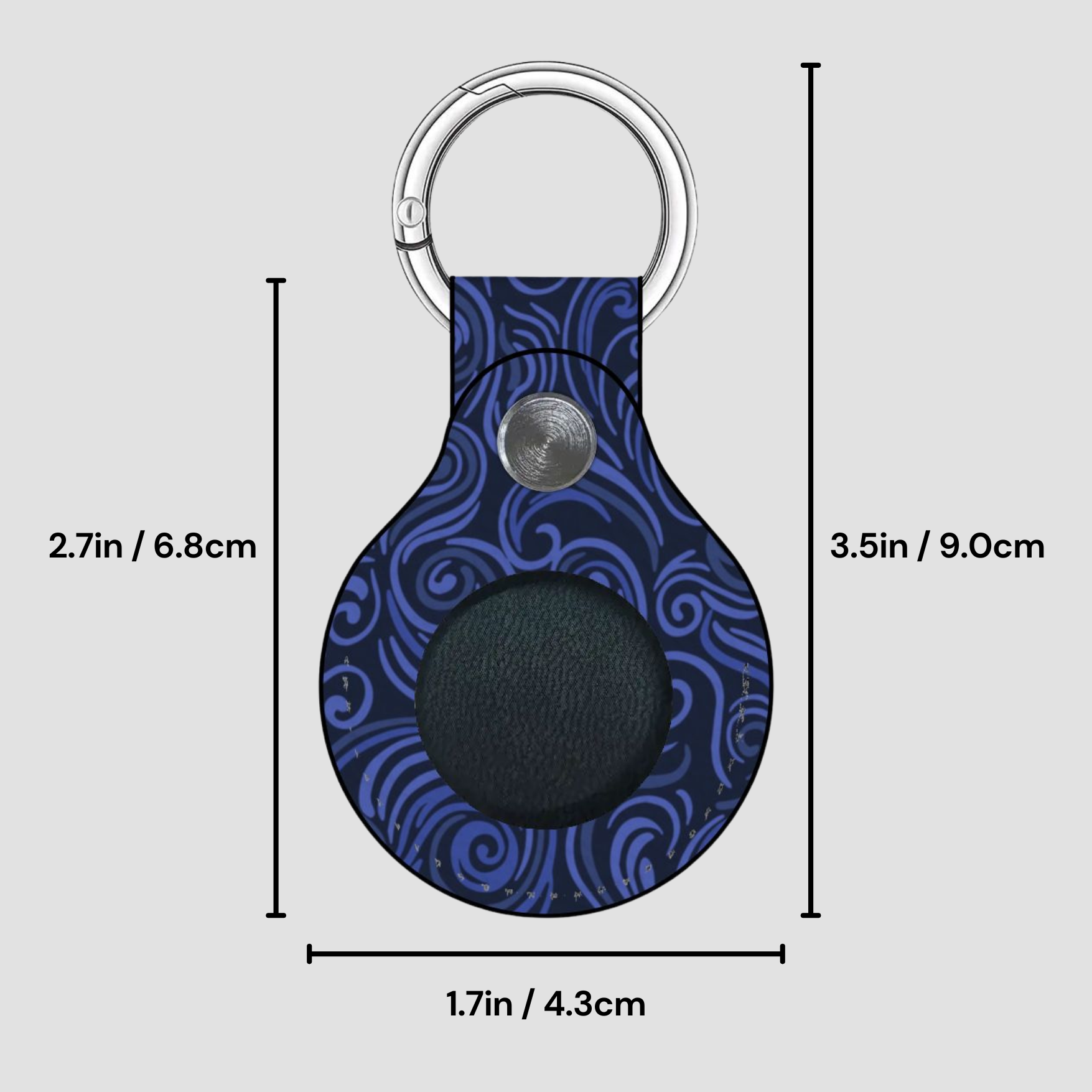Blue patterned keychain with measurements on a gray background