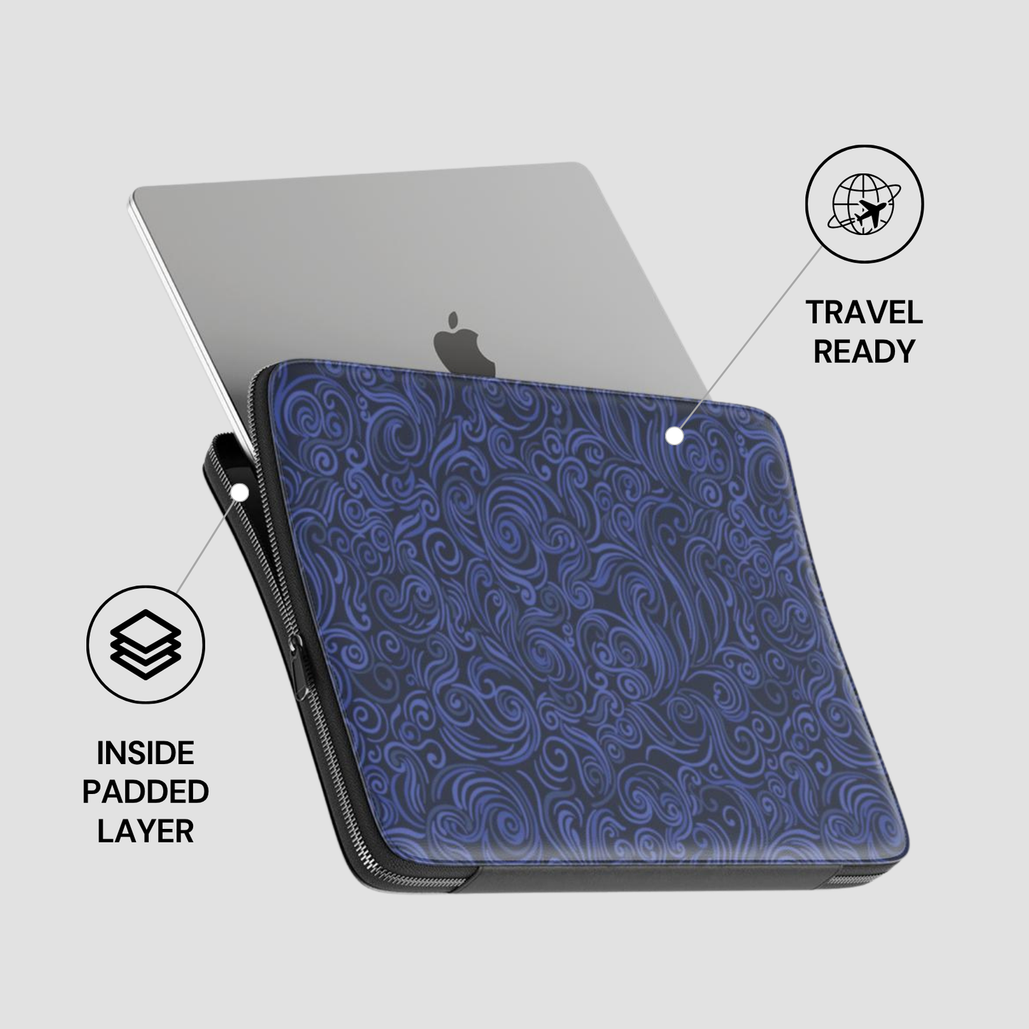 Blue patterned laptop sleeve with a silver laptop inside on a light gray background