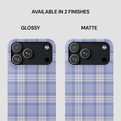 Two phone case designs, one glossy and one matte, on a plaid pattern background.