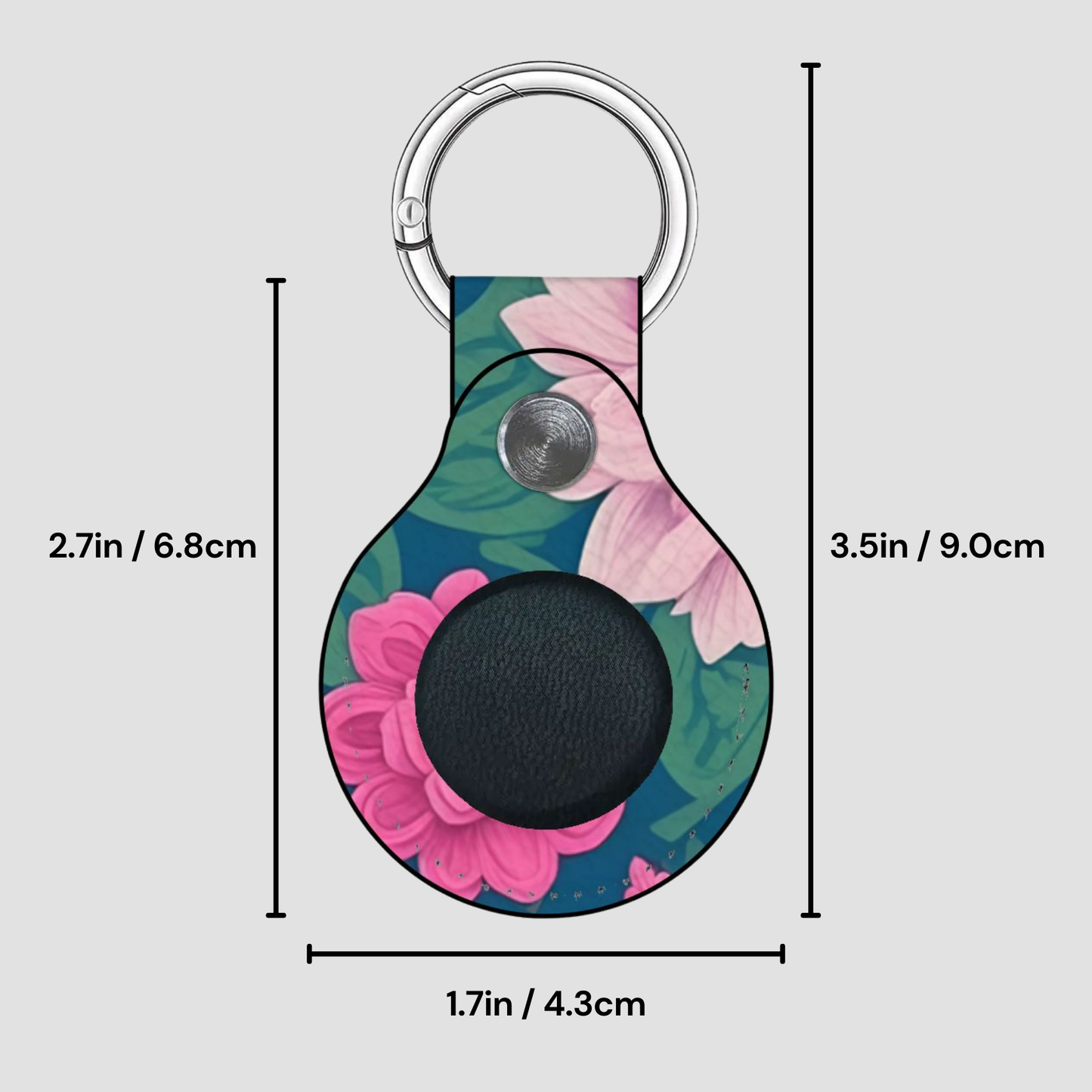 Floral patterned keychain with measurements on a gray background