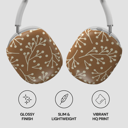 Pair of headphones with brown and white floral pattern on a light gray background