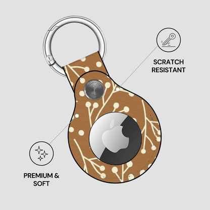 Keychain case with Apple logo on a light gray background