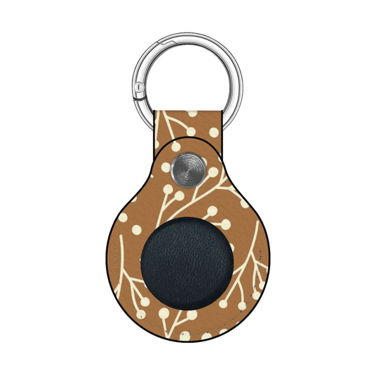 Keychain with brown pattern and black circle on a white background