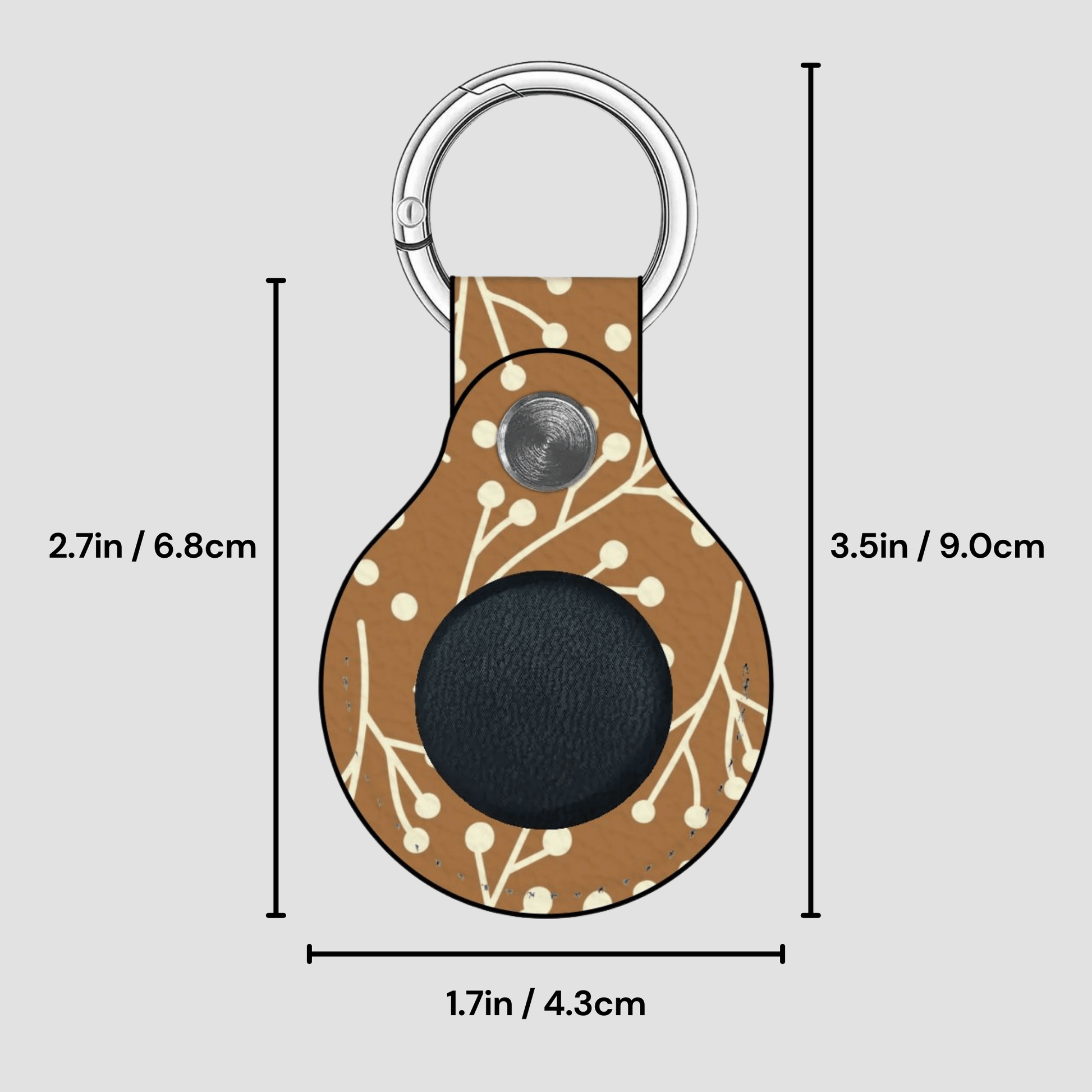 Keychain with floral pattern and measurements on a gray background