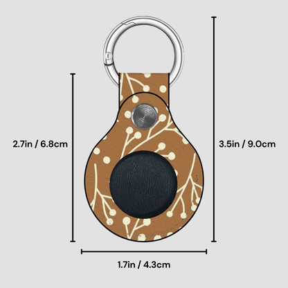 Keychain with floral pattern and measurements on a gray background