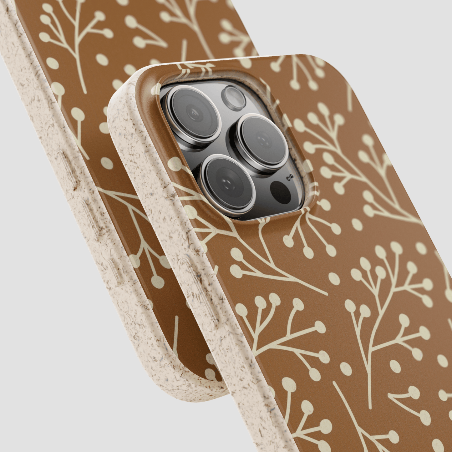 Phone case with brown and beige floral pattern on a light gray background