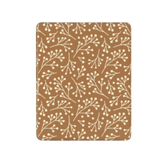 Patterned brown and beige mat with branch design on a white background