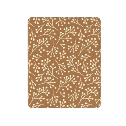 Patterned brown and beige mat with branch design on a white background