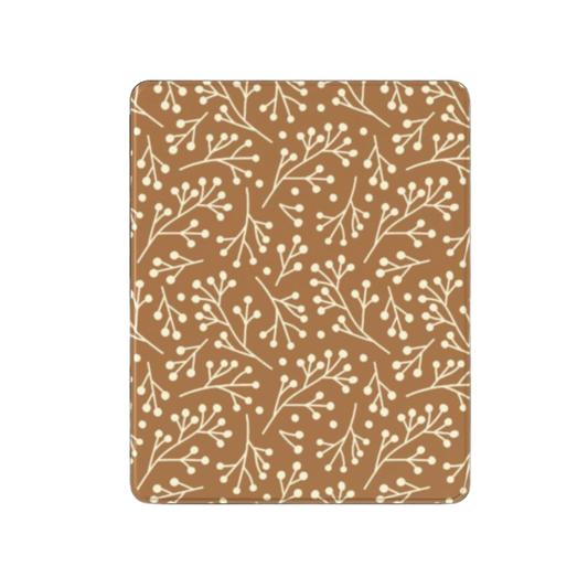 Patterned brown and beige mat with branch design on a white background