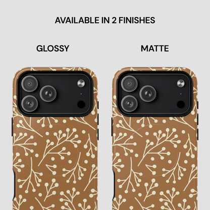 Two phone cases with a floral pattern, one glossy and one matte, on a light gray background.