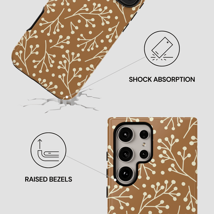 Phone case with brown floral pattern and features highlighted on a white background