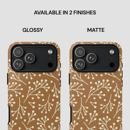 Two phone cases with a floral pattern, one glossy and one matte, on a white background.