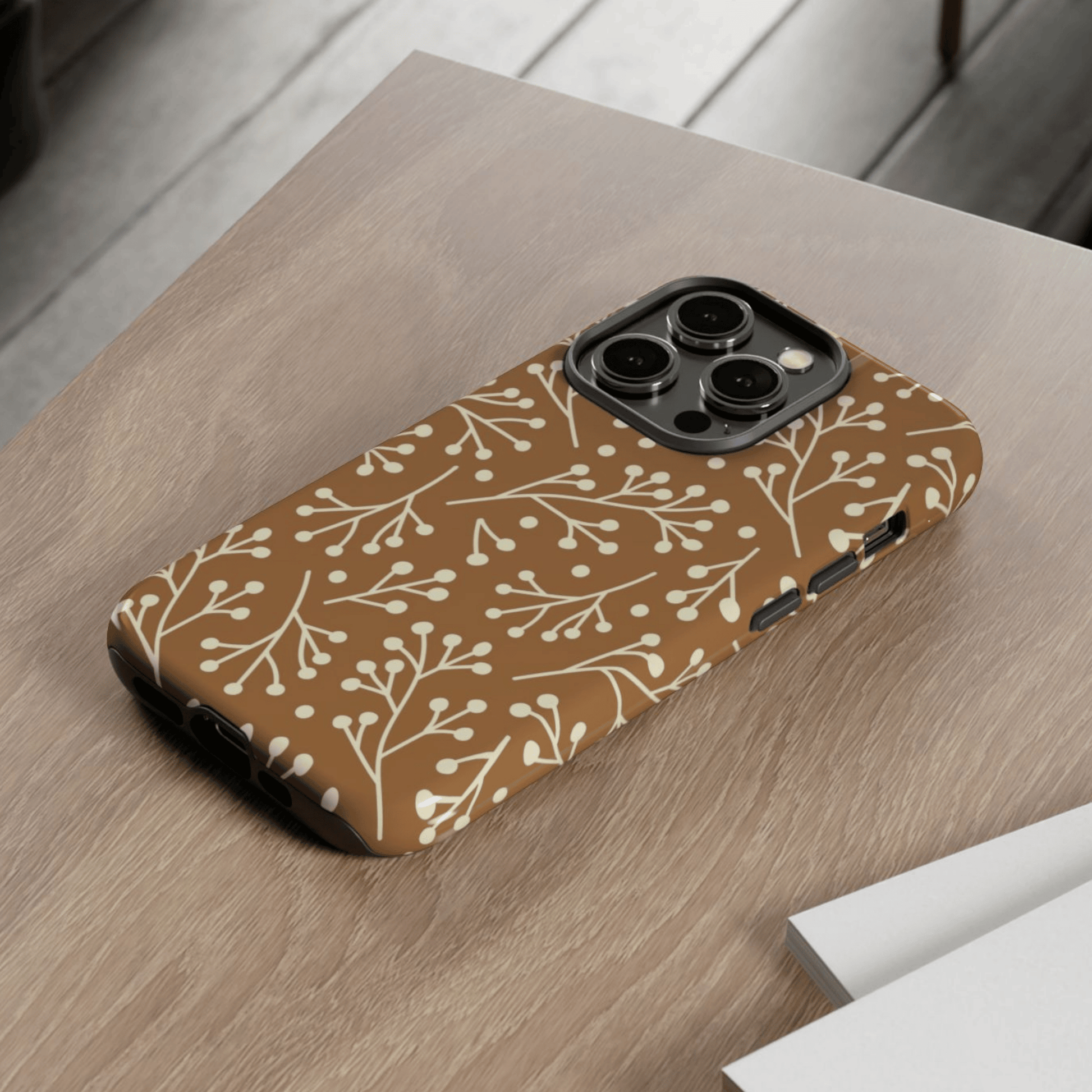 Phone case with a floral pattern on a wooden surface