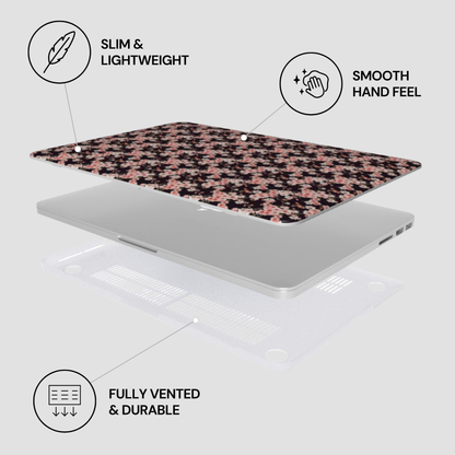 Laptop with a floral skin on a light gray background, featuring text labels about the product's features. | Casenari