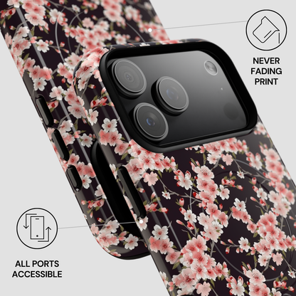 Floral phone case with cherry blossoms on a dark background, showing all ports accessible. | Casenari