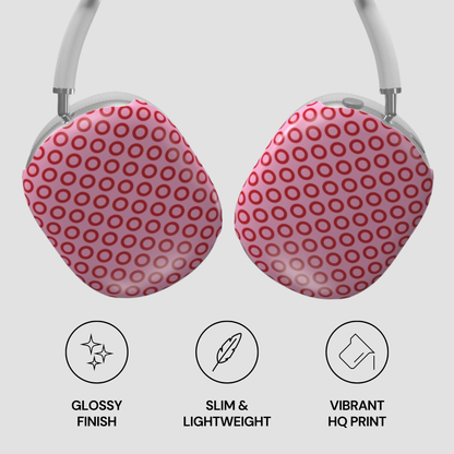Pink polka dot earrings with glossy finish, slim design, and vibrant print on a light gray background.