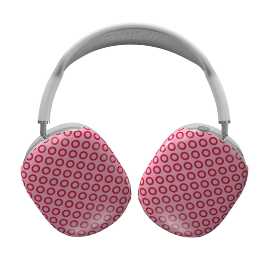 Pink and red polka dot headphones on a white background