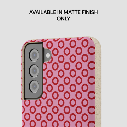 Phone case with red circular pattern on pink background