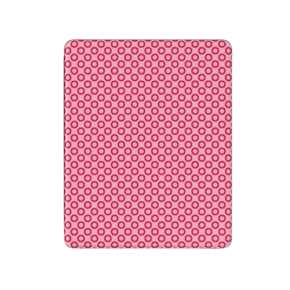 Pink silicone mat with circular pattern on a white background