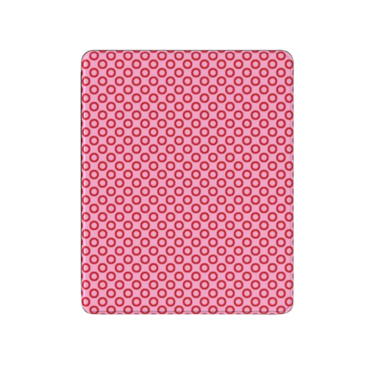 Pink silicone mat with circular pattern on a white background