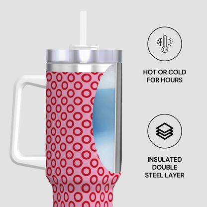 Insulated tumbler with pink circular pattern on a white background