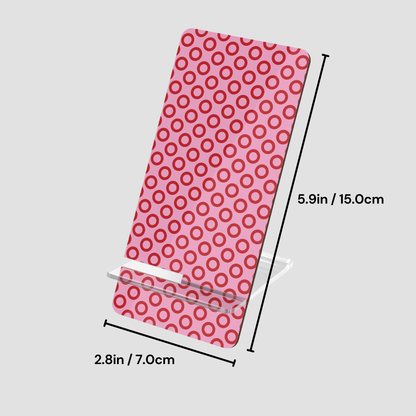 Pink phone case with red circular pattern and measurements on a light gray background