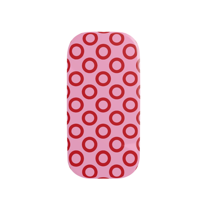 Phone case with red circle pattern on pink background