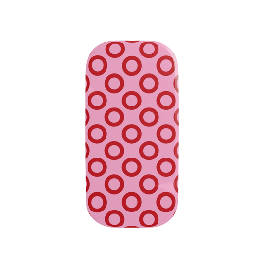 Phone case with red circle pattern on pink background