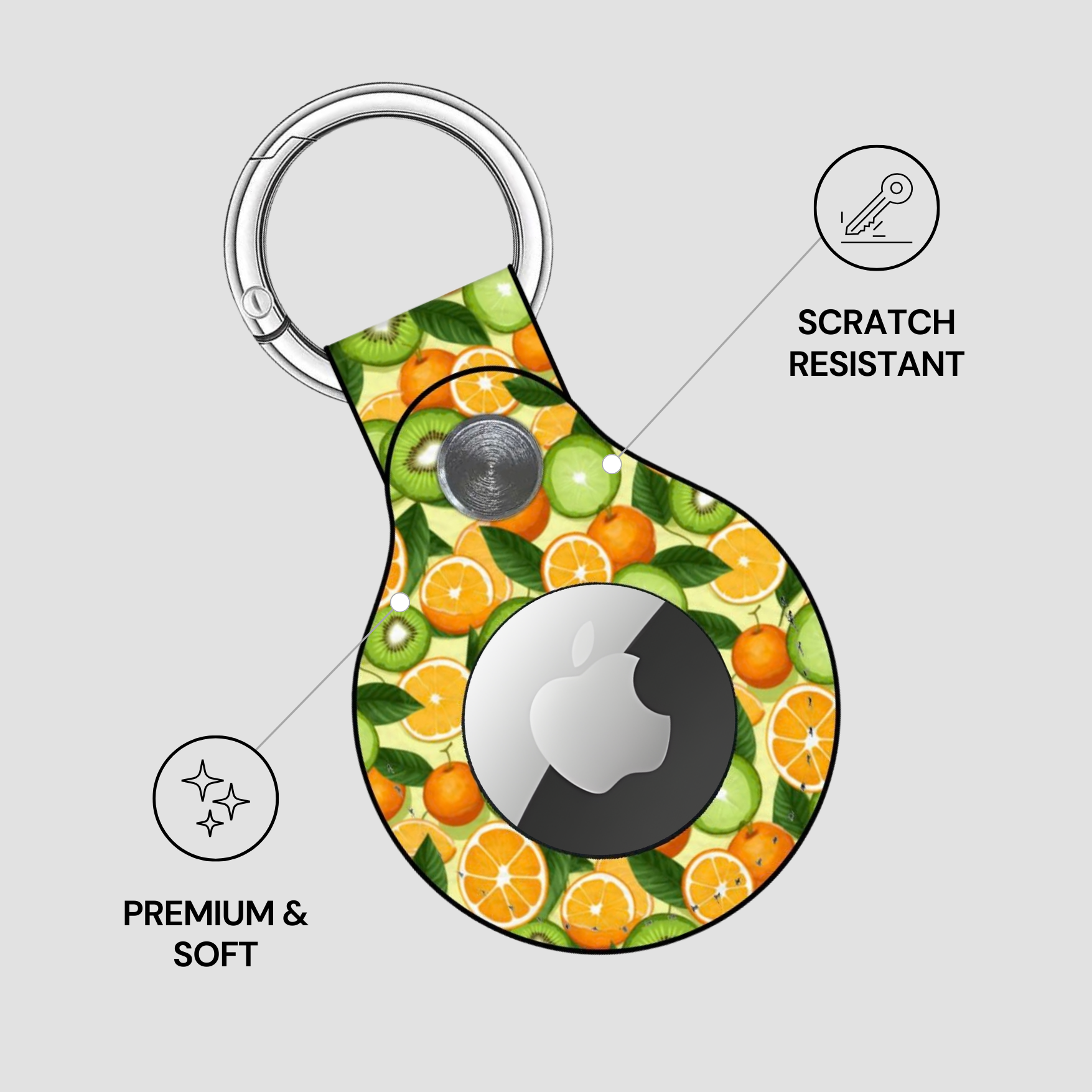 Keychain with fruit pattern and Apple logo on a light gray background