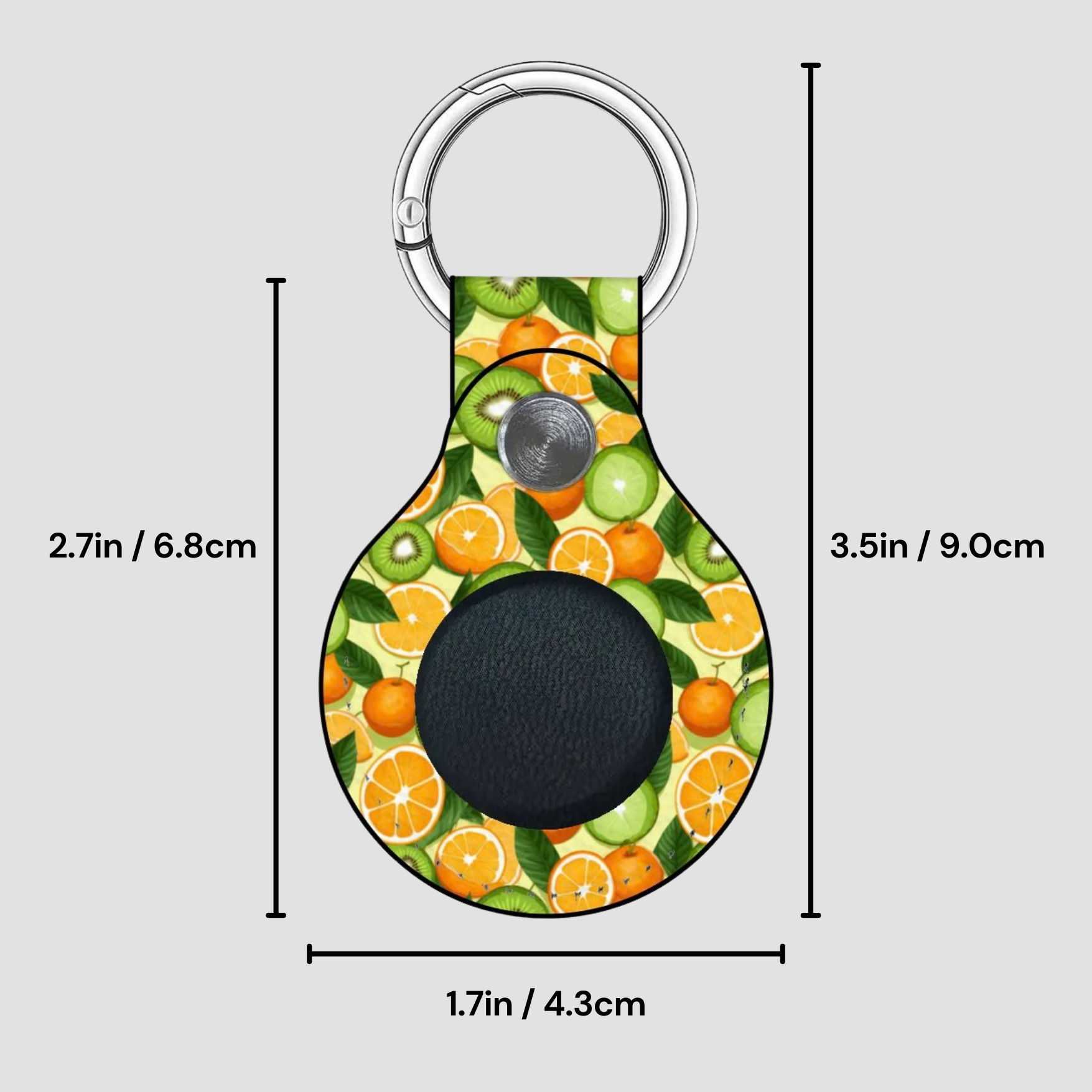 Keychain with fruit pattern and measurements on a gray background