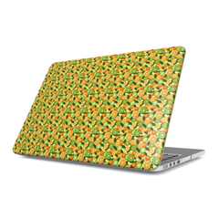 Laptop with a kiwi and orange pattern on a white background