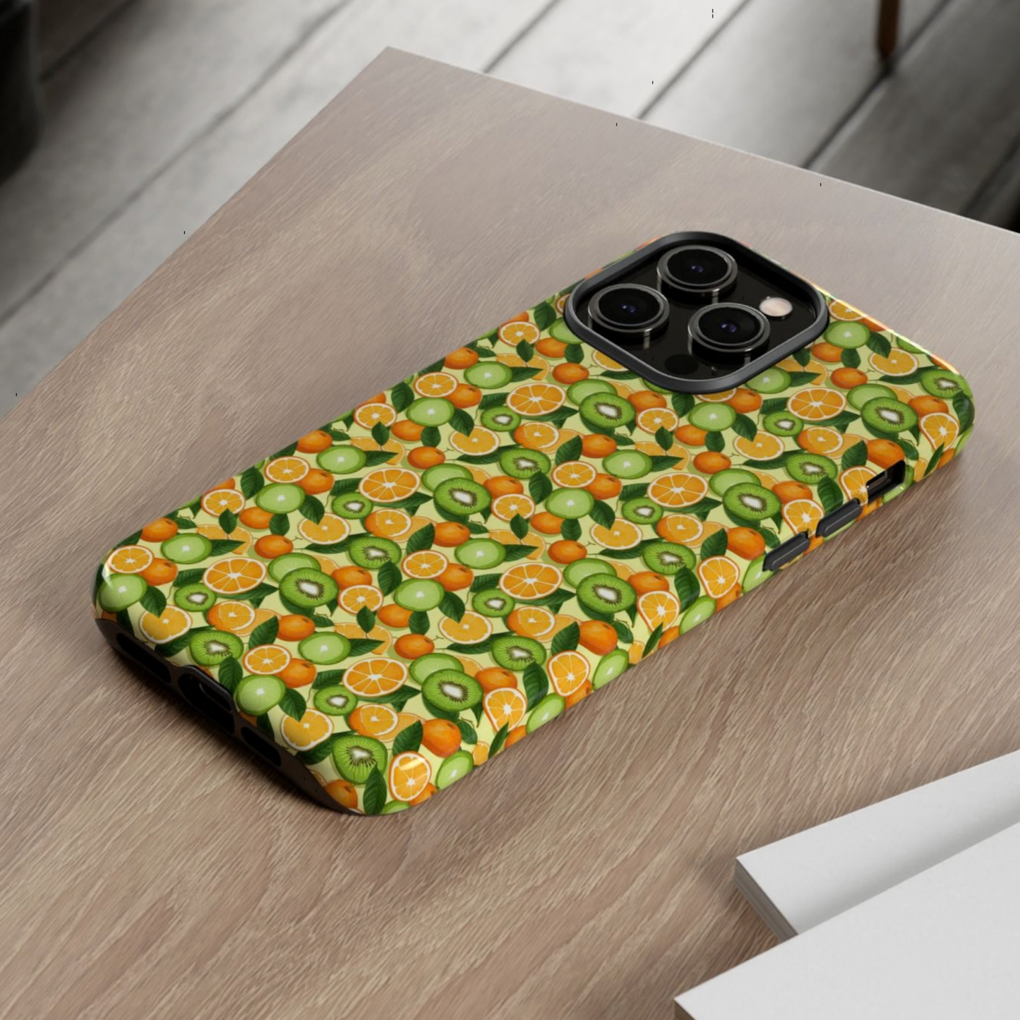 Phone case with fruit pattern on a wooden surface