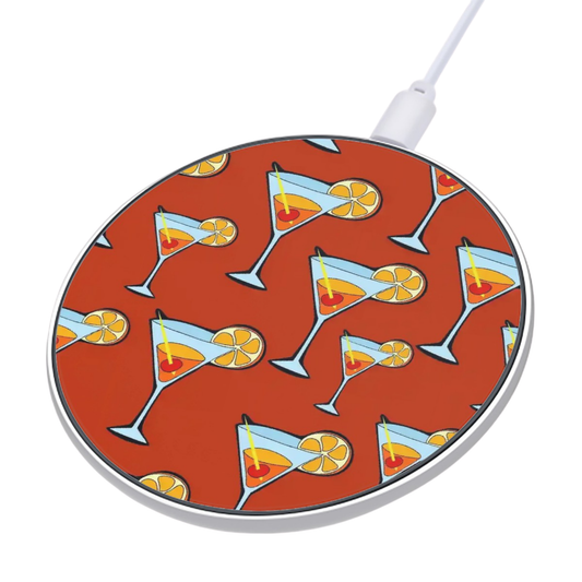 Wireless charging pad with cocktail design on a red background