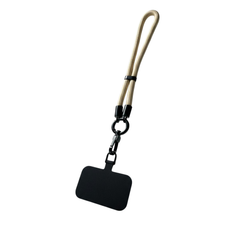 Black dog tag with beige strap on a white background