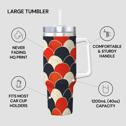 Large tumbler with colorful pattern, handle, and straw on a light gray background