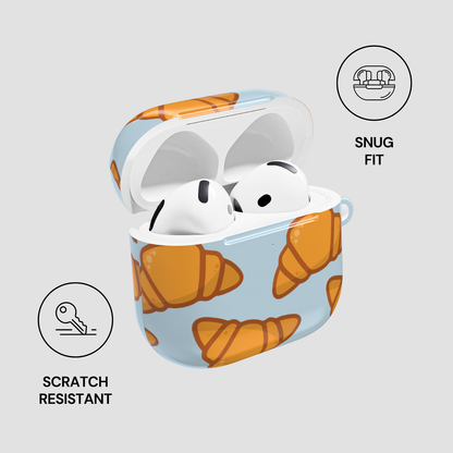 AirPods in a case with croissant pattern on a light gray background | casenari