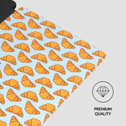 Patterned fabric with orange croissant design on a light blue background, featuring a 'Premium Quality' label. | Casenari