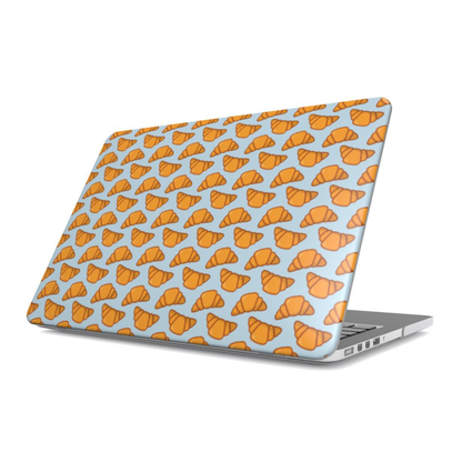 Laptop with a pattern of orange croissants on a light blue background | Casenari